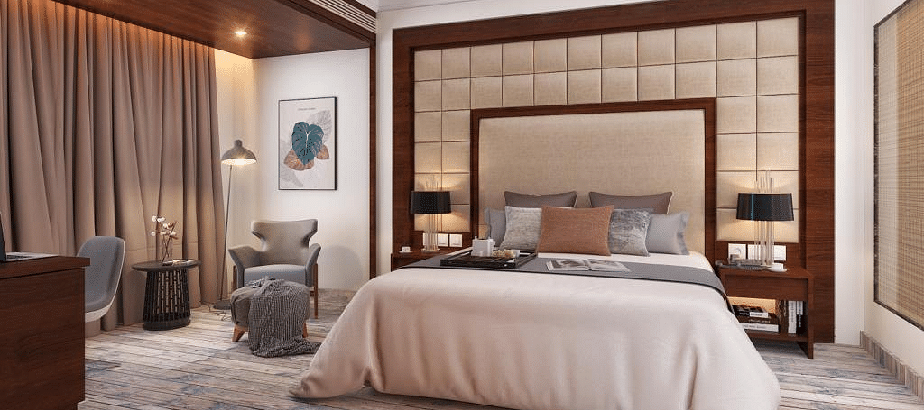 Suite with a king size bed and lamps on each side of the bed at BluSalzz Residence, Amritsar.